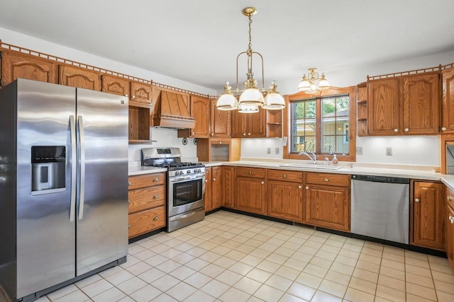 kitchen with custom range hood, hanging light fixtures, light tile patterned floors, stainless steel appliances, and sink