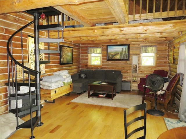 living room with wood ceiling, beam ceiling, a wood stove, log walls, and hardwood / wood-style flooring