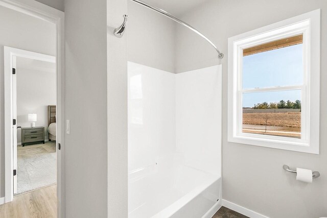 2876 Wild Goose Way, Stoughton, WI 53589 - full bath featuring baseboards, tub / shower combination, and wood finished floors