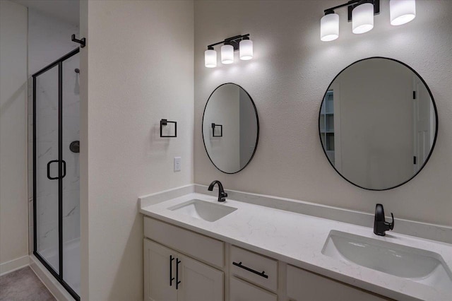 bathroom featuring vanity and an enclosed shower