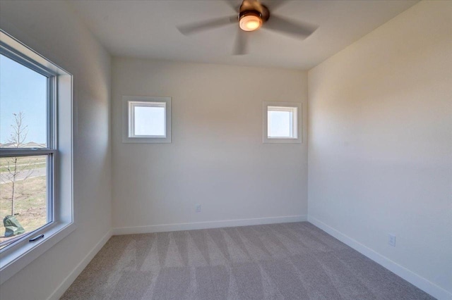 carpeted empty room with ceiling fan