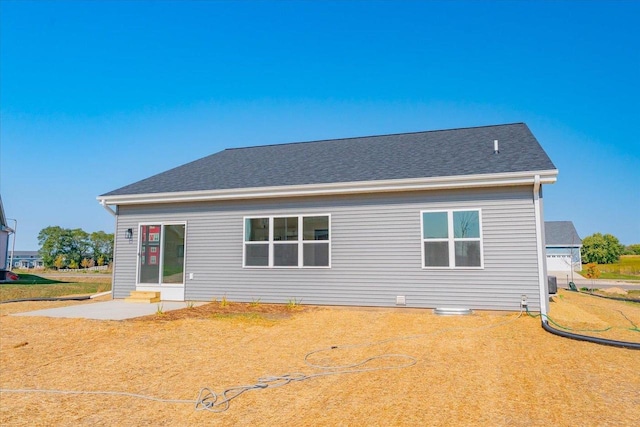 rear view of house featuring a yard