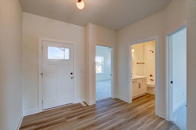 entrance foyer with light wood-type flooring