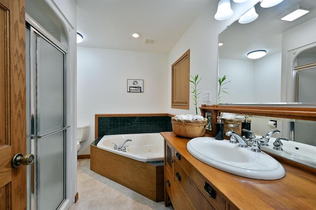 full bathroom featuring toilet, vanity, and separate shower and tub