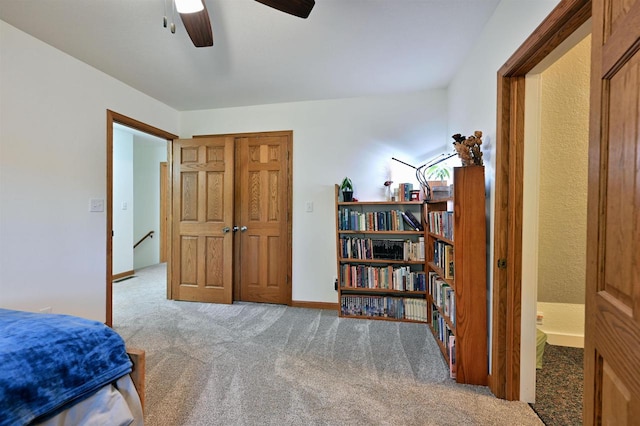 carpeted bedroom featuring ceiling fan