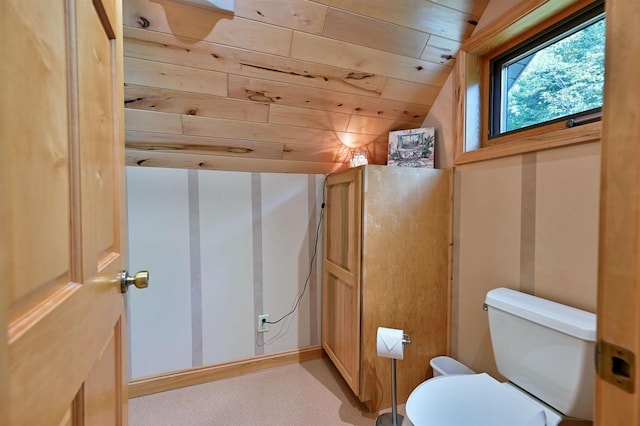 bathroom with wood ceiling, lofted ceiling, and toilet