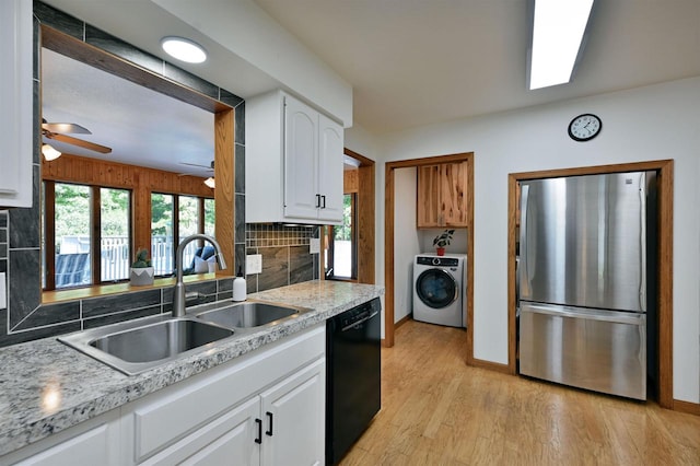 kitchen with ceiling fan, white cabinets, stainless steel refrigerator, dishwasher, and washer / dryer