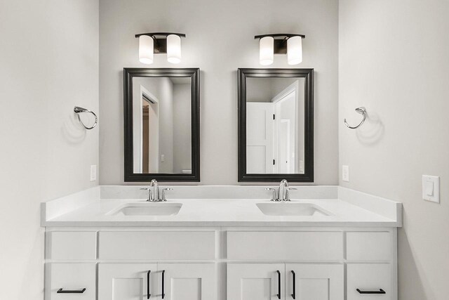 bathroom featuring double vanity and a sink