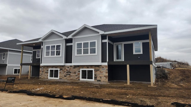 exterior space featuring stone siding