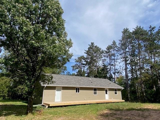 view of side of property with a lawn