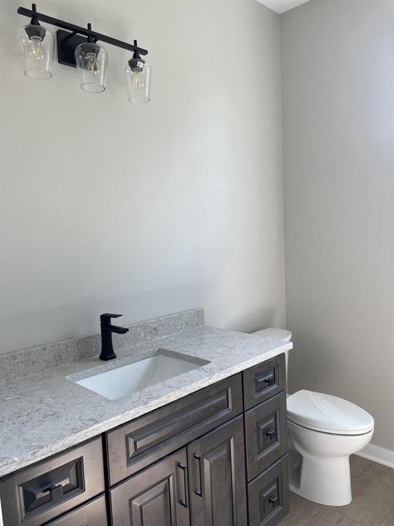 bathroom with vanity and toilet