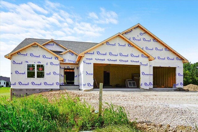 2171 Wallace Lake Rd, West Bend, WI 53090 - property under construction with driveway and an attached garage