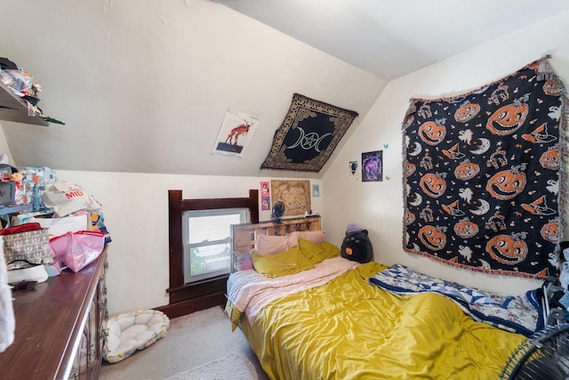 bedroom with carpet and vaulted ceiling