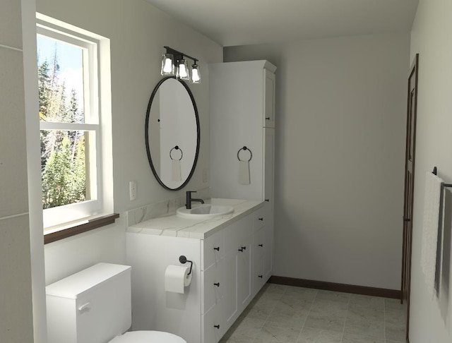 bathroom with vanity and toilet