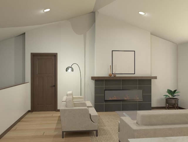 living room with light wood-type flooring, lofted ceiling, and a tile fireplace