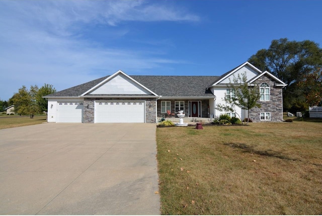 view of front facade featuring a front yard and a garage