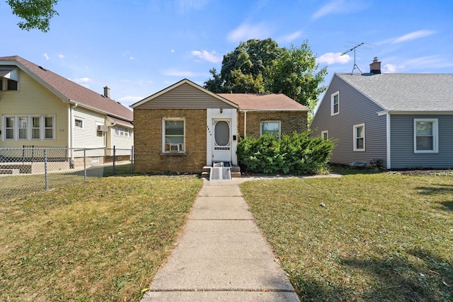 bungalow featuring a front yard