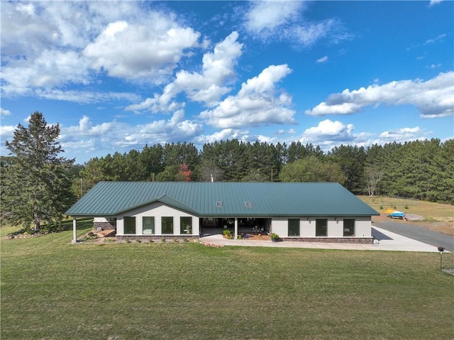 6030 Mitchell Rd, Iron River, WI 54847 - view of front facade with a front lawn and metal roof