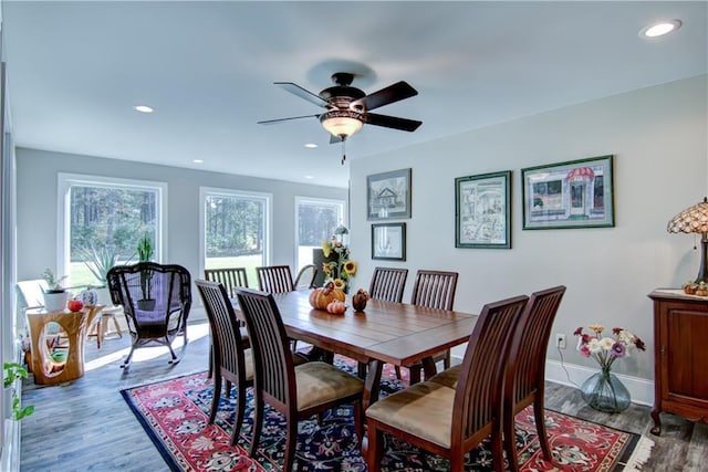 dining room with wood-type flooring and ceiling fan