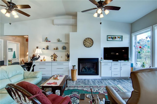 living room with ceiling fan, vaulted ceiling, and an AC wall unit