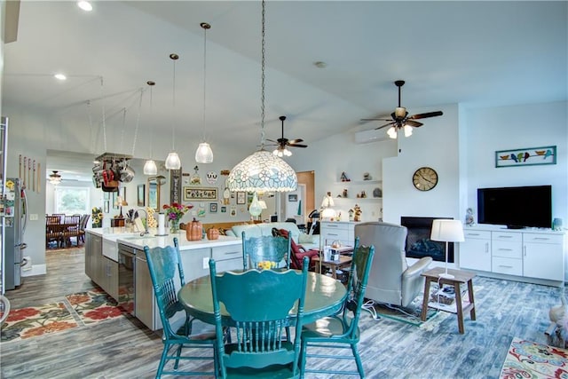 6030 Mitchell Rd, Iron River, WI 54847 - dining area with high vaulted ceiling, wood finished floors, ceiling fan, and recessed lighting