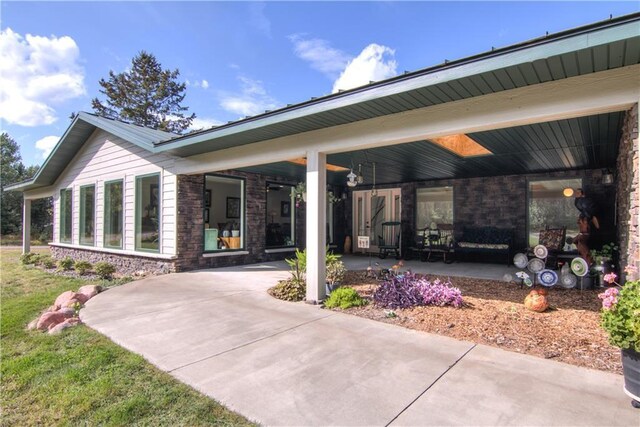 6030 Mitchell Rd, Iron River, WI 54847 - exterior space featuring covered porch and stone siding