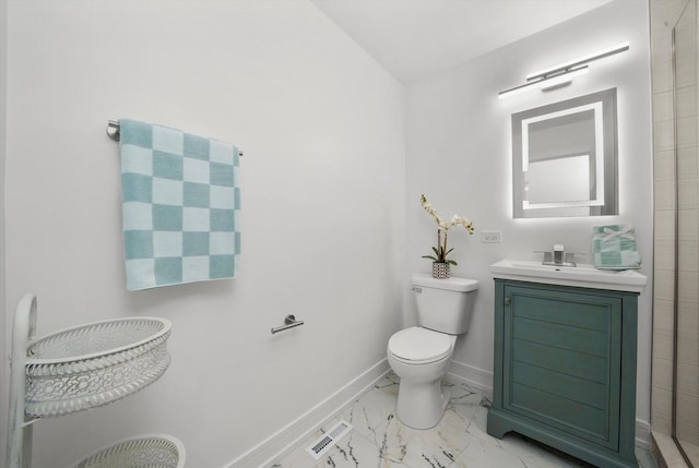 bathroom featuring toilet and vanity