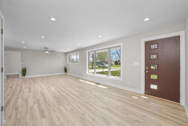 entrance foyer with light hardwood / wood-style flooring and ceiling fan