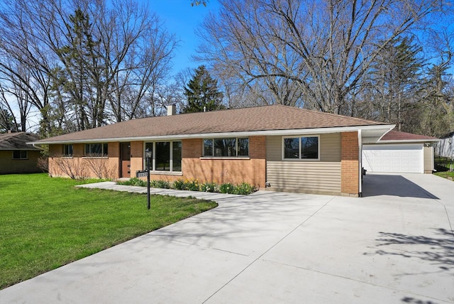 single story home featuring a front lawn and a garage