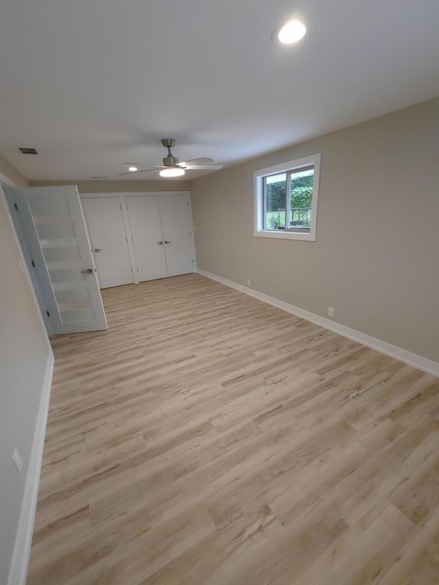 unfurnished bedroom featuring light hardwood / wood-style floors and ceiling fan