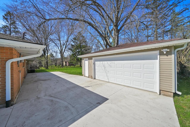 garage featuring a lawn