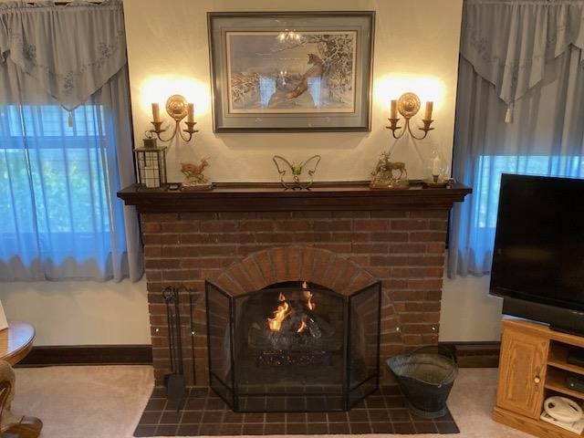 interior details with tile patterned flooring and a fireplace