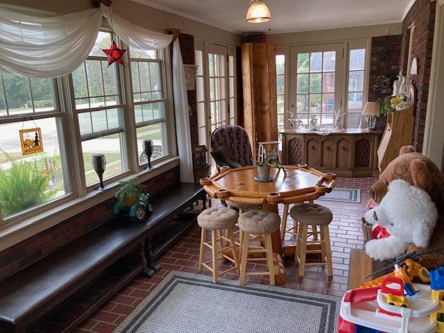 sunroom with plenty of natural light