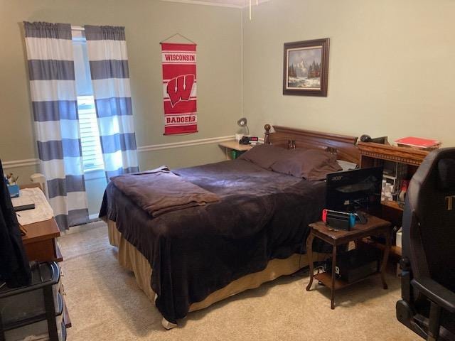 bedroom featuring light colored carpet