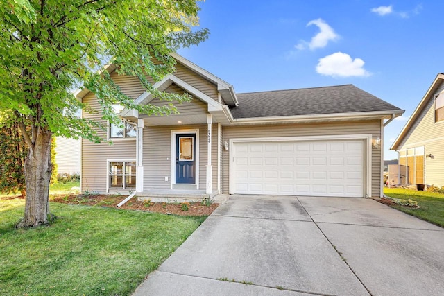 view of front of home featuring a garage and a front lawn