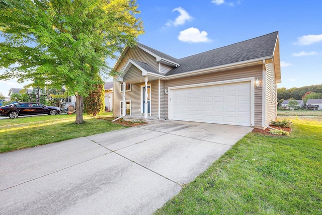 view of front of home with a garage and a front lawn