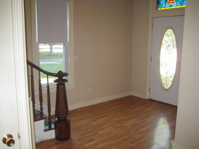 foyer entrance with hardwood / wood-style floors