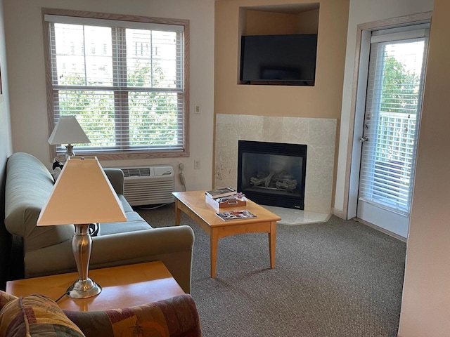 carpeted living room featuring a fireplace