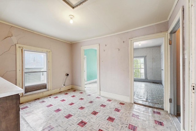 interior space with light parquet floors and ornamental molding