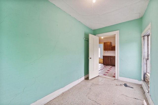 unfurnished bedroom featuring light colored carpet