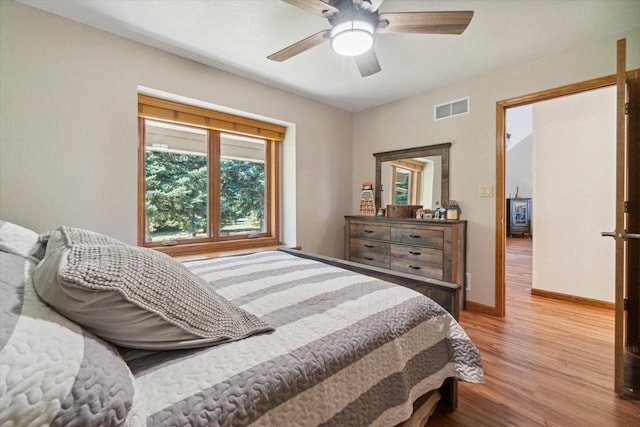 7001 Novak Rd, Racine, WI 53402 - bedroom with wood finished floors, baseboards, and ceiling fan