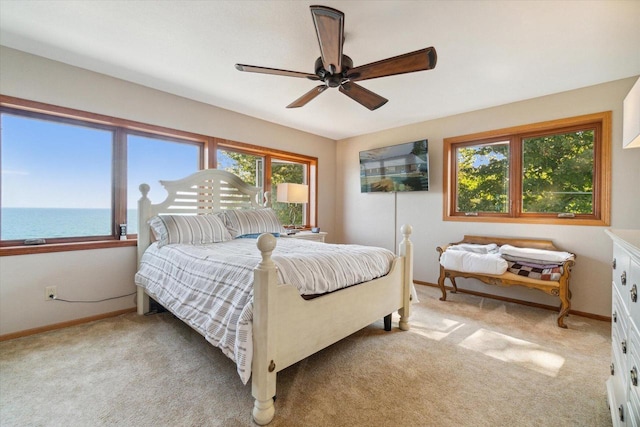 7001 Novak Rd, Racine, WI 53402 - bedroom with light colored carpet, a water view, baseboards, and ceiling fan