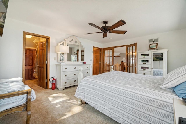 7001 Novak Rd, Racine, WI 53402 - carpeted bedroom with a ceiling fan and french doors