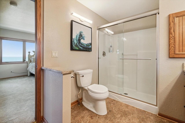 7001 Novak Rd, Racine, WI 53402 - bathroom featuring a stall shower, toilet, and baseboards