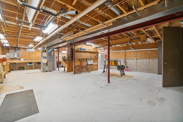 7001 Novak Rd, Racine, WI 53402 - basement featuring a workshop area, water heater, and heating unit