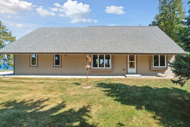 7001 Novak Rd, Racine, WI 53402 - rear view of house with roof with shingles and a lawn