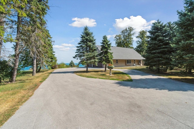 7001 Novak Rd, Racine, WI 53402 - view of front of house with curved driveway and a front yard