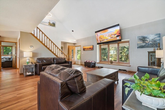 7001 Novak Rd, Racine, WI 53402 - living area with stairway, light wood finished floors, and high vaulted ceiling