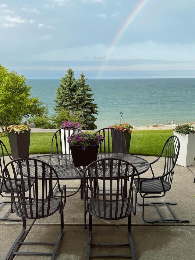 7001 Novak Rd, Racine, WI 53402 - view of patio / terrace with a water view and outdoor dining area