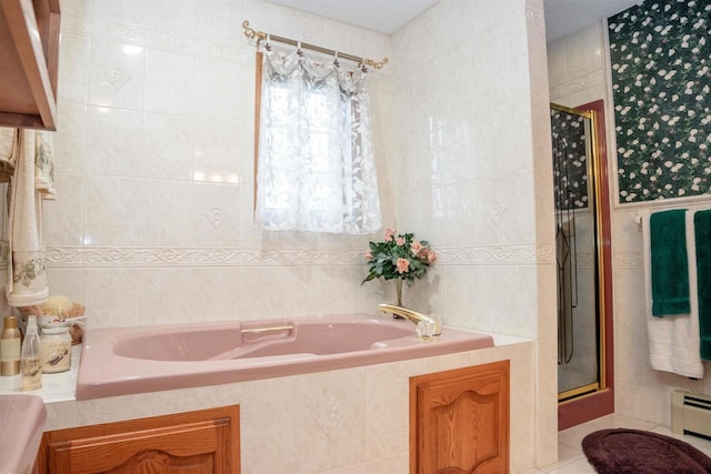 bathroom featuring separate shower and tub and tile walls